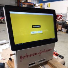 A desk-mounted Slimline kiosk undergoing servicing, produced for Johnson & Johnson