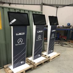Slimline kiosks configured for visitor sign-in, produced for Victoria’s Rail Academy viewed from an angle